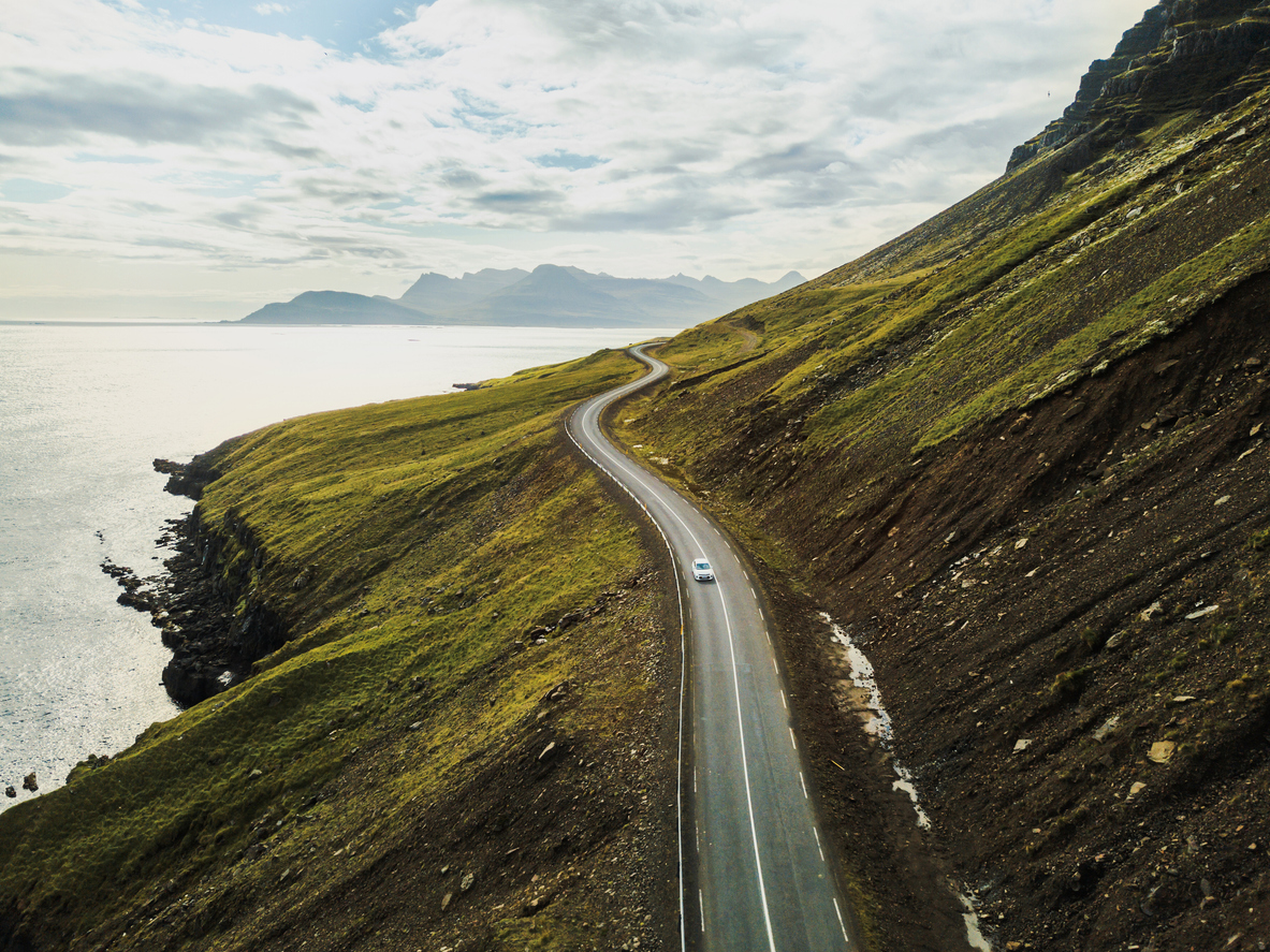 Car driving on beautiful scenic road in Iceland.