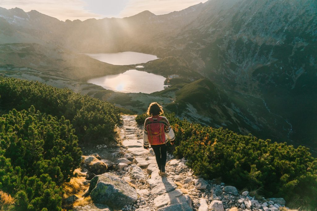 Woman walking near the lake in Tatra mountains