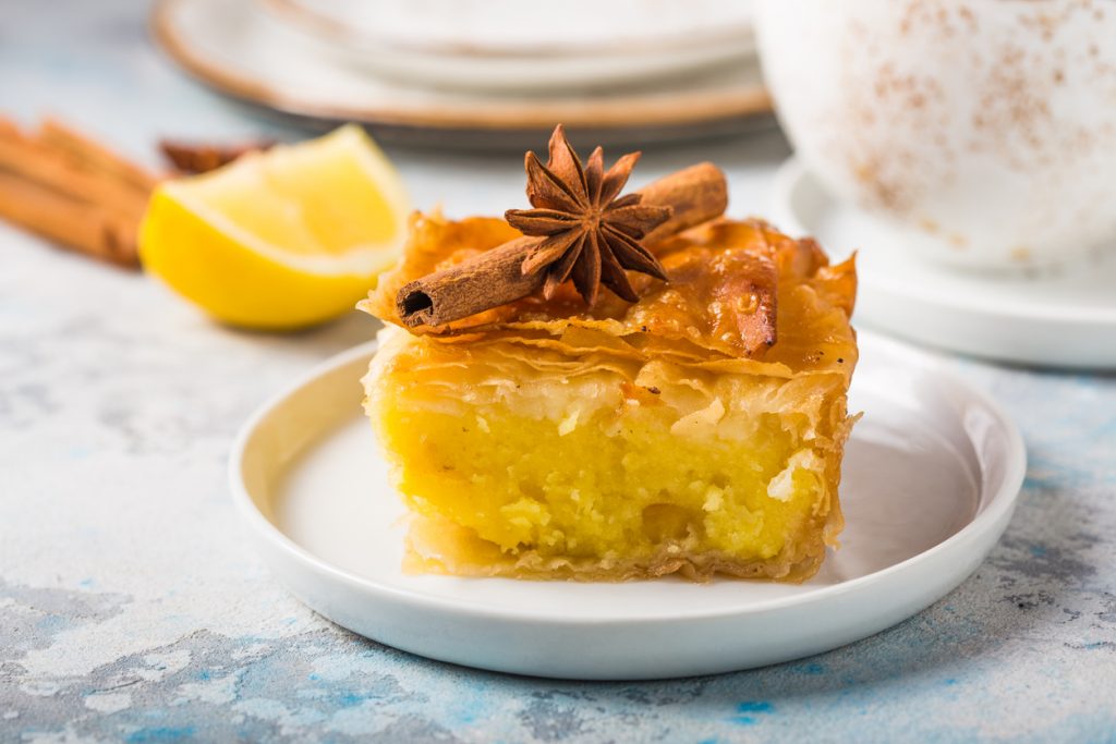 Custard of “Galaktoboureko” or bougatsa Greek traditional dessert baked in a pan with syrup.