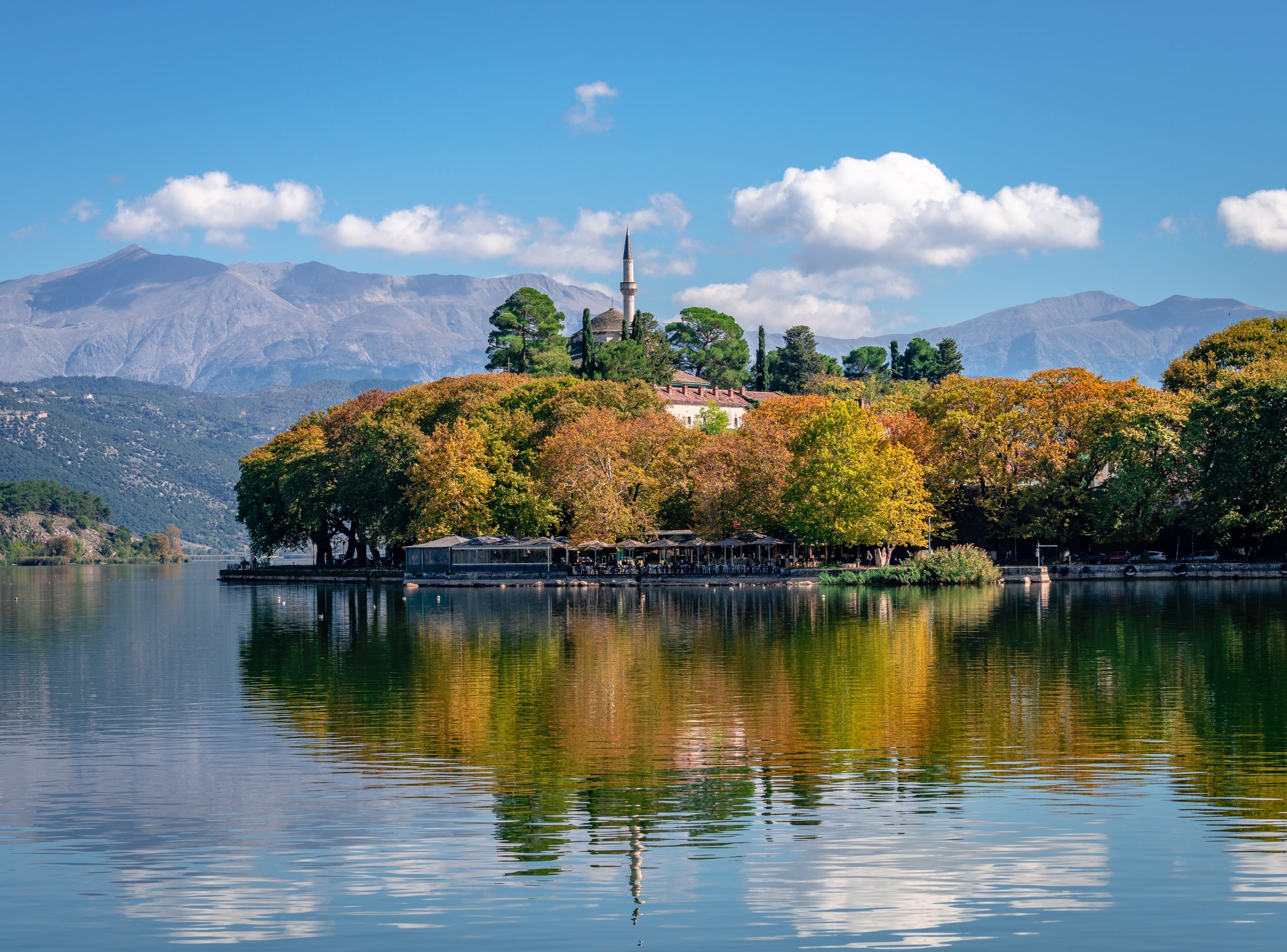 The Old Castle and the Aslan Pasha Mosque in Ioannina, Greece. Reflections on lake Pamvotis.