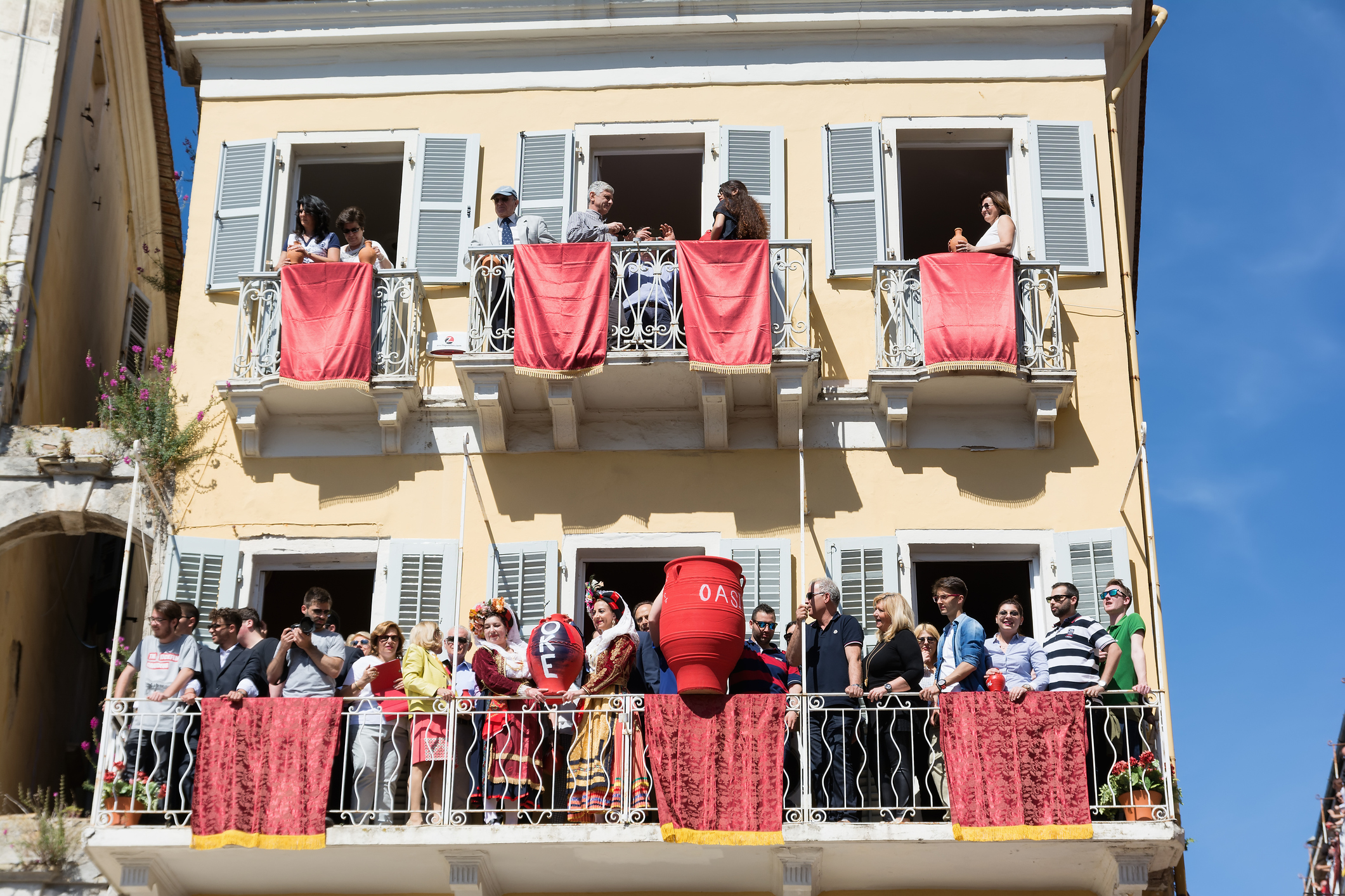 Corfians throw clay pots from  balconies on Holy Saturday, Corfu.