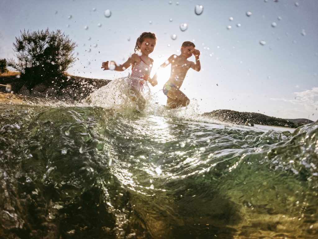 Kids playing in the sea