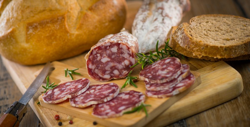 French salami Sausage on a wooden table